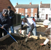 Dawda digging in an allotment.